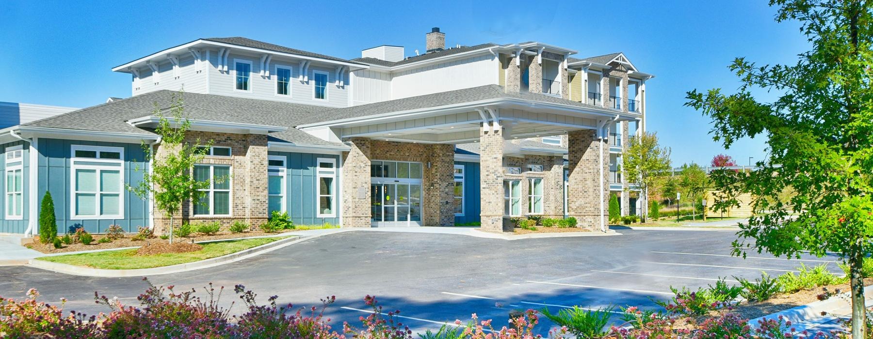 a large house with a pool in front of it