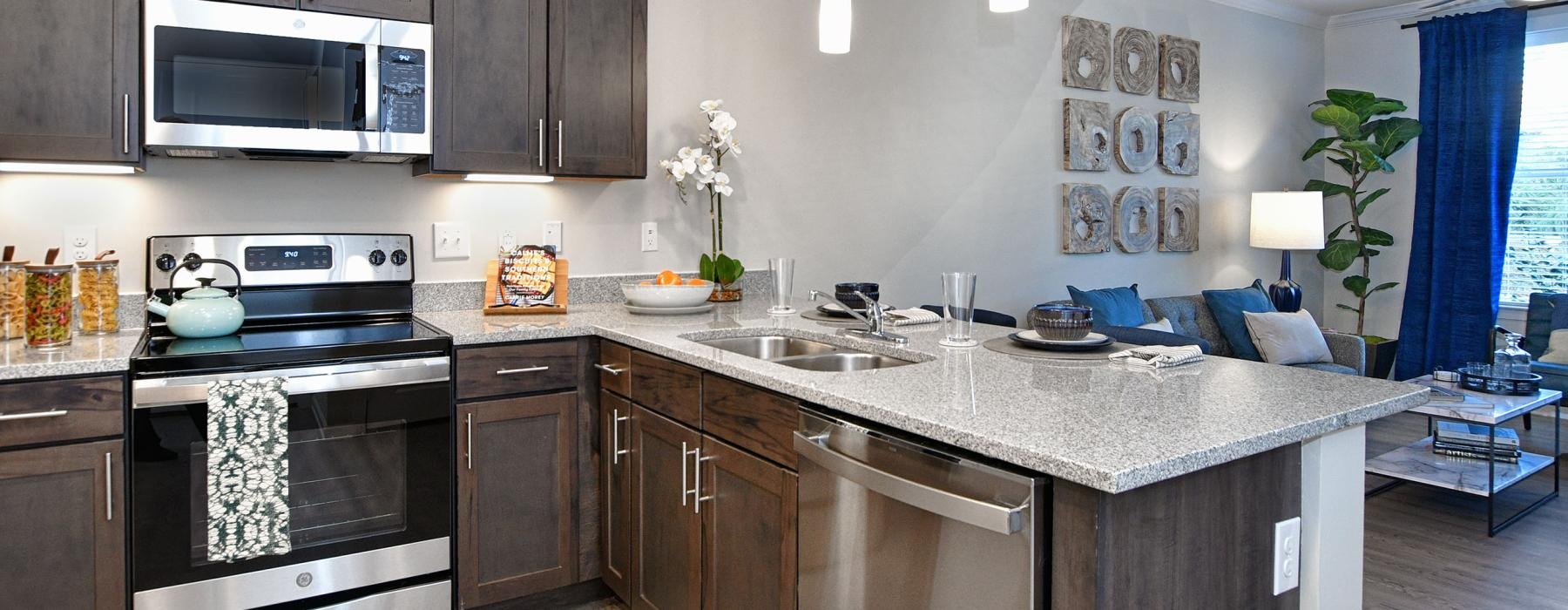 a kitchen with a stove and oven