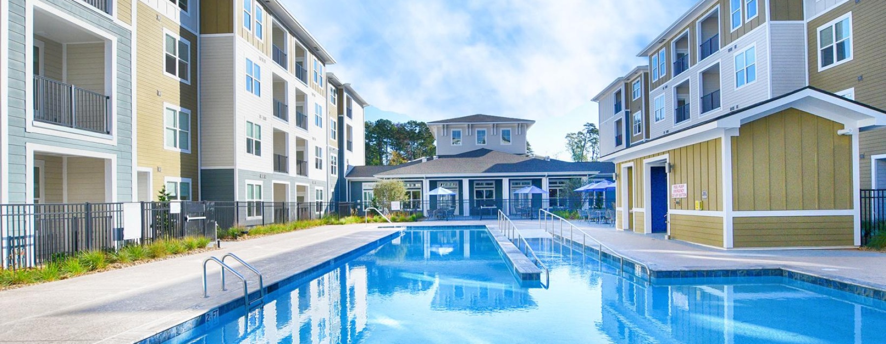 a swimming pool in a courtyard between buildings